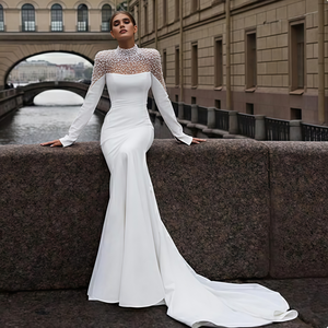 sachin and babi light blue dress A Modern, Elegant Wedding in Texas With an All-White Color Palette main image 1