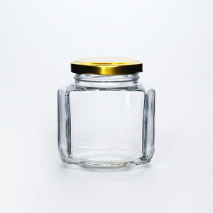 Haute Silex Vide Récipient En Verre Ovale Bocal En Verre Hexagonal Avec Or Couvercle De <span class=keywords><strong>Cosse</strong></span> En Métal Pour La Confiture - Product Image 1