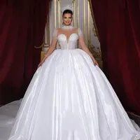Robe de mariée de luxe à col montant, transparente, ornée de perles, à manches longues, style robe de bal