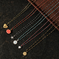 Collier superposé délicat style bohème en acier titane plaqué or PVD 18K avec perles colorées multi-formes, breloques cœur, étoile et pièce de monnaie