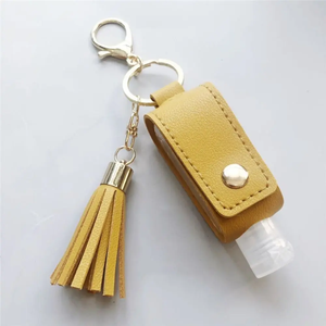 Sac de rangement multifonctionnel, bouteille de voyage portable multifonction, porte-clés, bouteille à main, porte-clés en cuir PU avec pompon, pour voiture - Product Image 1