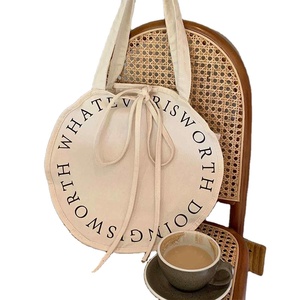 Sac publicitaire personnalisé en toile grande capacité, circulaire, avec poignée en sangle PP et impression de lettres typographiques audacieuses - Product Image 1