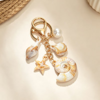 Porte-clés élégant style crème coquillage, breloque de sac en métal étoile de mer et conque pour femme, décoration de sac à main d'été, cadeau