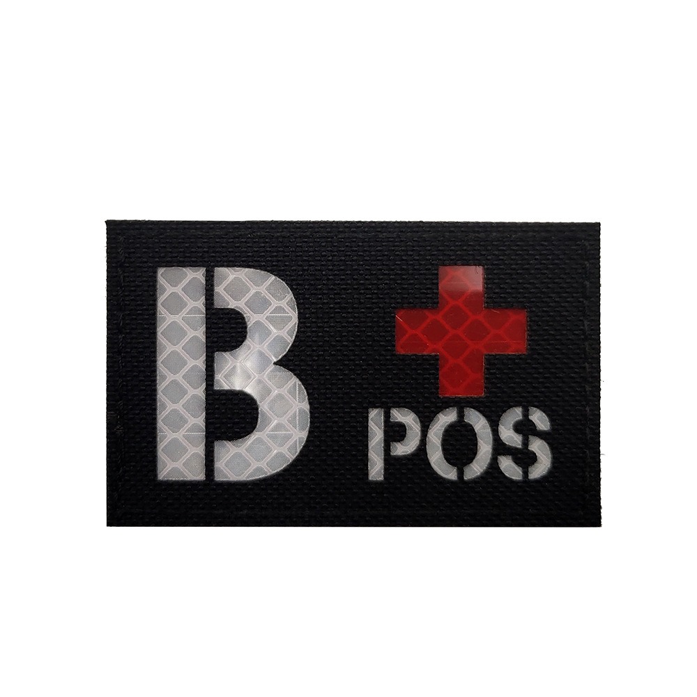 Black cloth with white letters B+