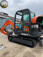Excavatrice sur chenilles Doosan DH60 7 d'occasion, prête à être expédiée, unité compacte de 6 tonnes pour les travaux de terrassement en arrière-cour.