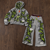 Ensemble personnalisé pour homme : sweat à capuche gris zippé et pantalon large avec motif abstrait lignes vertes et ourlet brut OEM ODM