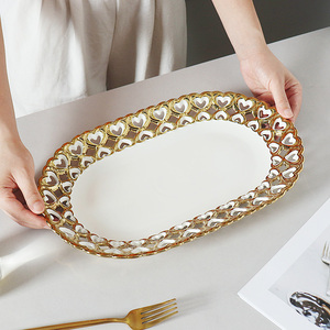 <span class=keywords><strong>Assiette</strong></span> ovale élégante de luxe dorée pour banquet, <span class=keywords><strong>assiette</strong></span> ovale en céramique pour restaurant, <span class=keywords><strong>assiette</strong></span> de présentation pour pâtes et desserts avec bordure en forme de cœur évidé - Product Image 4