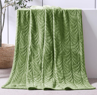 Couverture en flanelle ultra douce et soyeuse avec motif de feuilles en relief, personnalisable OEM ODM, quatre saisons, 100% polyester, chaleur somptueuse pour canapé, lit, sofa