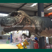 Grande tête de dinosaure animatronique à l'usine de production de dinosaures ou tête de robot Tyrannosaurus Rex grandeur nature pour parc extérieur
