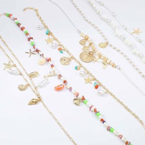 Collar de estilo bohemio con conchas marinas y estrellas de mar, ideal para vacaciones en la playa, con cuentas y piedras trituradas, en capas, para llevar alrededor de la clavícula. - Product Image 6