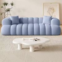 Canapé d'angle style crème inspiré de la texture des nuages noirs Marshmallow pour petit appartement, hôtel, villa, avec revêtement en tissu