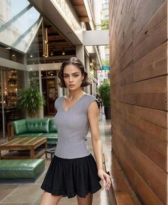 Mini-jupe élégante taille haute pour femmes, vêtements de soirée d'été décontractés à volants et coupe biais, style formel, approvisionnement naturel en gros