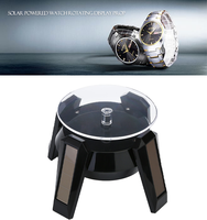 Technologie solaire créative avancée Table d'affichage de montre de plateau tournant à LED Porte-bijoux mobile avec conception de vaisseau spatial rotatif