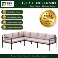 Canapé d'angle extérieur en forme de L avec structure en métal noir et coussins rose poudré, mobilier de jardin