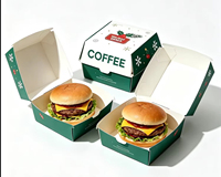 Ensemble d'emballages à emporter sur le thème de Noël avec boîte à burger, carton à pizza, porte-gobelet et porte-frites pour chaîne de restauration rapide en gros