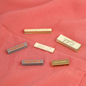 Customized <b>Gold</b> Metal Logo Rope Crimp Clamp Clothing Label Cord End Tail Clip for Jeans and <b>Clothes</b> - Product Image 1