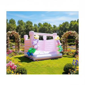 Château gonflable professionnel rose pastel et noir avec toboggan et piscine à balles pour fêtes et mariages - Product Image 1