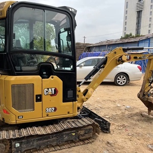 Mini-excavatrice CAT 302 d'occasion, très demandée, peu d'heures de fonctionnement, en stock, expédition directe à bas prix, à vendre. - Product Image 1