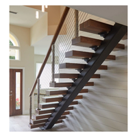 Escalier sur mesure flottant à monopoutre, design à colonne unique, marches en noyer, garde-corps en acier inoxydable