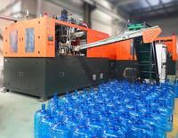 Machine de fabrication de conteneurs d'eau en PET de 20 L (5 gallons) à haute efficacité et automatique, dotée de moteurs à cylindre rotatif PLC