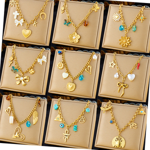 Collier de mode en acier inoxydable à plusieurs niveaux plaqué or à la mode avec des breloques de chaîne d'oeil de croix de cerise de coquille de nœud de coeur - Product Image 1
