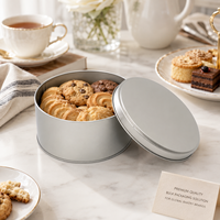 Boîte à biscuits ronde personnalisée avec logo imprimé, fabricant OEM, finition mate bleu marine et intérieur doré, emballage métallique de qualité alimentaire
