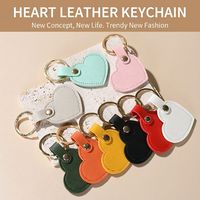 Porte-clés en cuir PU en forme de cœur de couleur unie avec logo personnalisé, porte-clés promotionnel en cuir, breloque de sac en forme de cœur pour souvenir