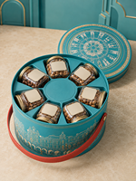 Boîte cadeau cylindrique de style européen haut de gamme en papier spécial cyan avec logo personnalisé, fabriquée à la main, avec poignée en cuir, pour aliments et noix