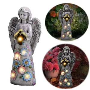 阿里巴巴中国供应商户外太阳能庭院灯树脂天使雕像，带十字架或花朵天使美国订购花园装饰