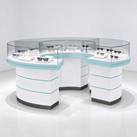 Présentoir à lunettes blanc incurvé en îlot avec garde-corps en acrylique et garniture bleu clair CE ETL pour magasin d'optique