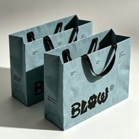 Sacs cadeaux en papier de luxe bleu sur mesure avec poignée en ruban pour bijoux, colliers, bagues et cadeaux de marque haut de gamme
