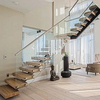 Escaliers modernes droits en bois massif chêne foncé avec marches flottantes en acier à usage intérieur de l'usine de Foshan