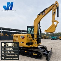 Excavatrice Caterpillar 305.5 d'occasion, 5600 kg, avec godet standard et lame de bouteur
