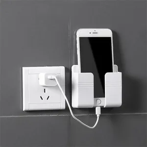 लोकप्रिय स्टॉक Multifunction के नए दीवार फोन धारक चिपकने वाला मोबाइल फोन दीवार चार्जर धारक और रिमोट कंट्रोल खड़े हो जाओ