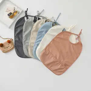 New Style Good Selling Baby Bib Waterproof Solid PU Feeding Bib with Pocket short Sleeve Soft Child Apron Smock