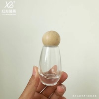 Stock du fabricant Vente en gros Bouteille transparente en verre à tête de pompe à bouche de canard avec compte-gouttes pour lotion de presse de 30ml