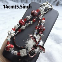 Breloque de téléphone Dragon à ailes rouges et duveteuses, ornée de strass et de perles, avec cordon de poignet pour sac, bijou artisanal pour femme, cadeau