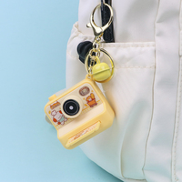 Nouveau design Mini Creative Instant Camera Keychain obturateur son et lampe de poche porte-clés