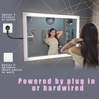 Miroir de salle de bain LED intelligent à intensité variable, rectangulaire, style moderne OEM, avec fonction anti-buée et éclairage LED pour hôtel