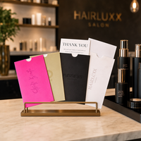 Pochettes en papier personnalisées imprimées avec une encoche découpée et un logo en feuille d'or pour les marques d'extensions capillaires et de produits de beauté