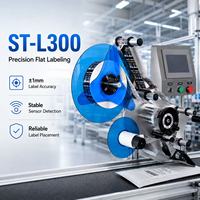 Etiquetadora de Superficie Plana Compacta IPS ST-L300 Controlada por PLC para Bolsas, Cajas y Productos en Láminas