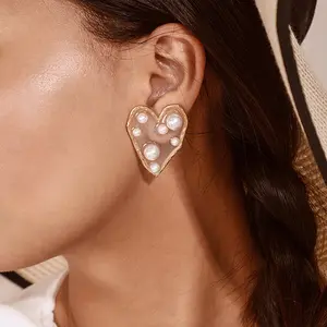 Boucles d'oreilles à perle dorée pour femmes, bijou à clou en forme de cœur, mode coréenne Yang chenglin, même tempérament, irrégulière, sauvage, amour