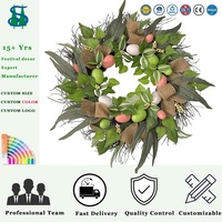 Couronne de Pâques artificielle de 22/24 pouces avec œufs colorés, lapins, fleurs et feuilles vertes pour la décoration de la porte d'entrée
