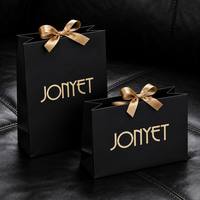 Sacs cadeaux en papier personnalisés de haute qualité avec logo sur mesure et poignée en ruban pour l'emballage des produits de soin de la peau, service d'usine de production tout-en-un