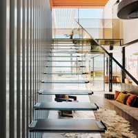 Escalier flottant haut de gamme sur mesure avec structure en acier cantilever pour bâtiment résidentiel