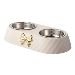 Doppia ciotola in acciaio inossidabile resistente per cani e gatti con Bowknot intagliato Design perfetto per l'alimentazione e l'idratazione