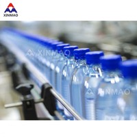 Machine de remplissage automatique d'eau minérale potable Ligne de production complète Moteur à engrenages PLC pour boissons Bouteilles en plastique Moteur à pompe