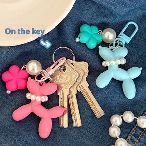 Globo de dibujos animados perro llavero Kawaii colorido suave Pvc auricular caso bolsa encanto accesorios encantador flor perro globo llavero - Product Image 4