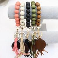 Porte-clés Vintage en bois extensible, diverses séries, disque en bois monogramme, daim, gland, porte-clés, Bracelet élastique