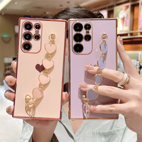 Coque de téléphone brillante électroplaquée avec bracelet cœur pour femmes et filles, compatible iPhone 18 Samsung S26